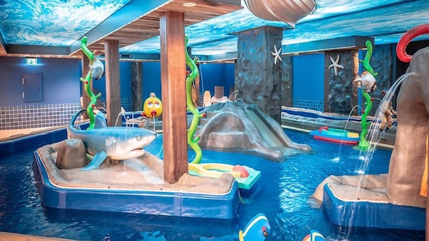 An indoor water park with various aquatic play areas, including slides and pools. - Ferien- und Freizeitpark Weissenhauser Strand (Wangels)