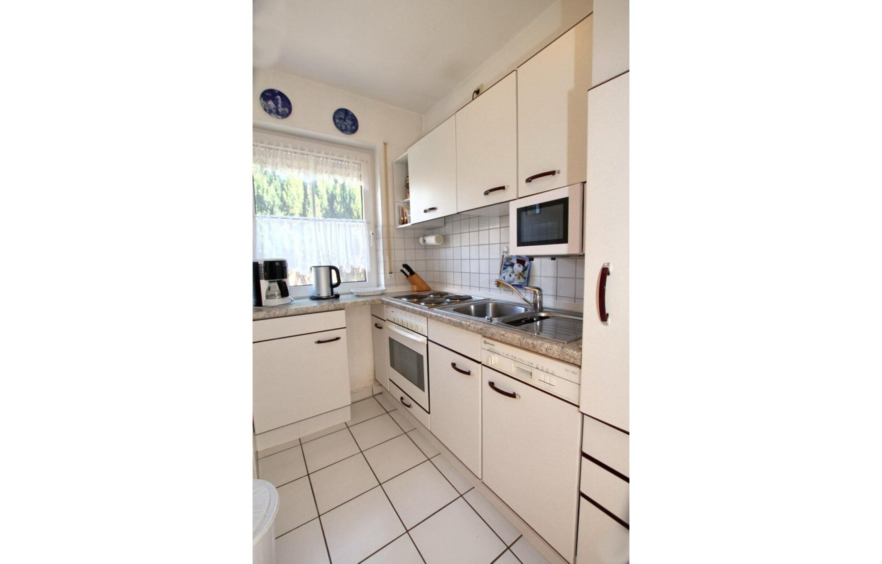 Casa | Cocina privada | Hervidor eléctrico y trona infantil