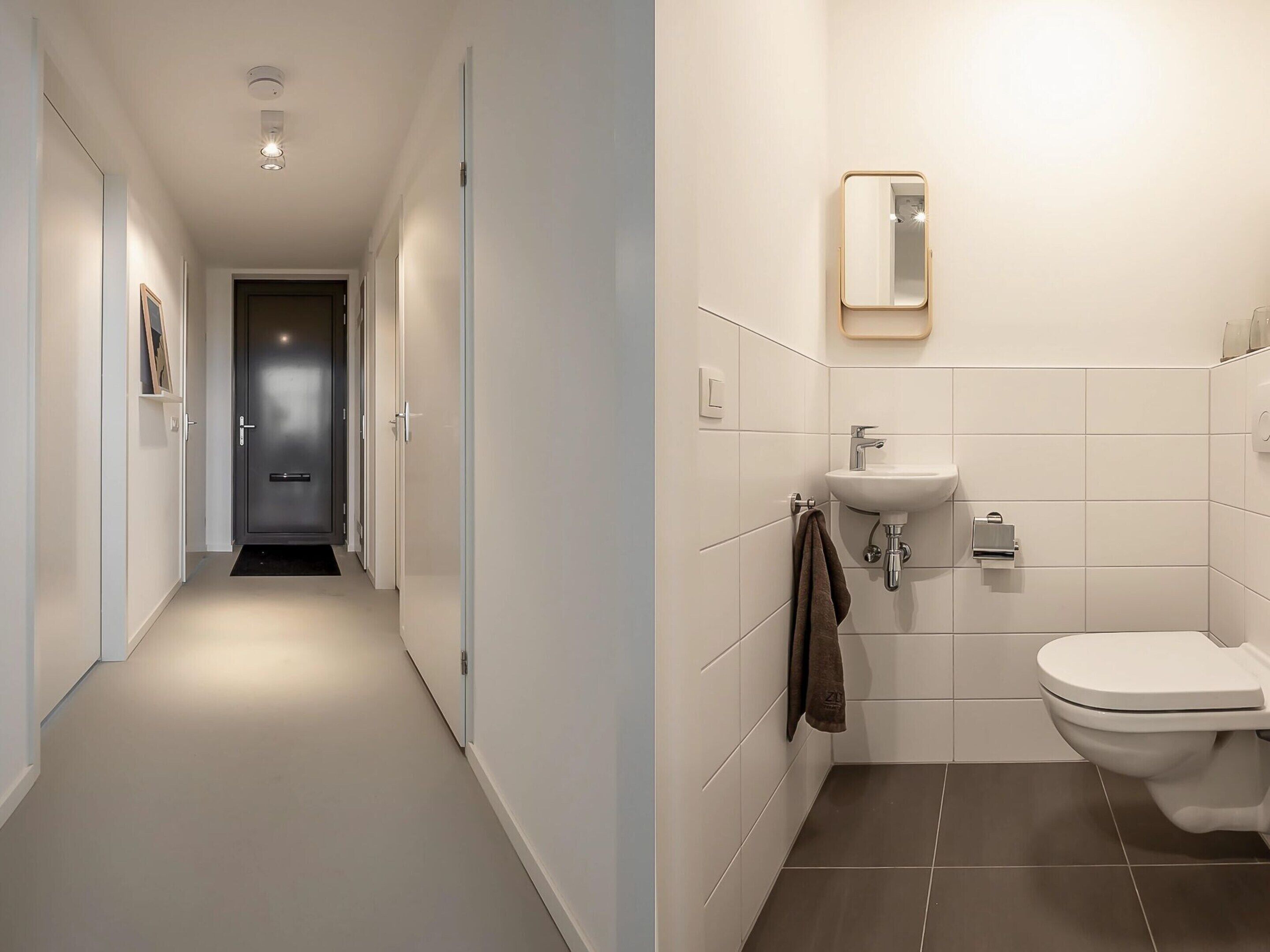 Une salle de bain moderne avec des toilettes, un lavabo et un miroir.