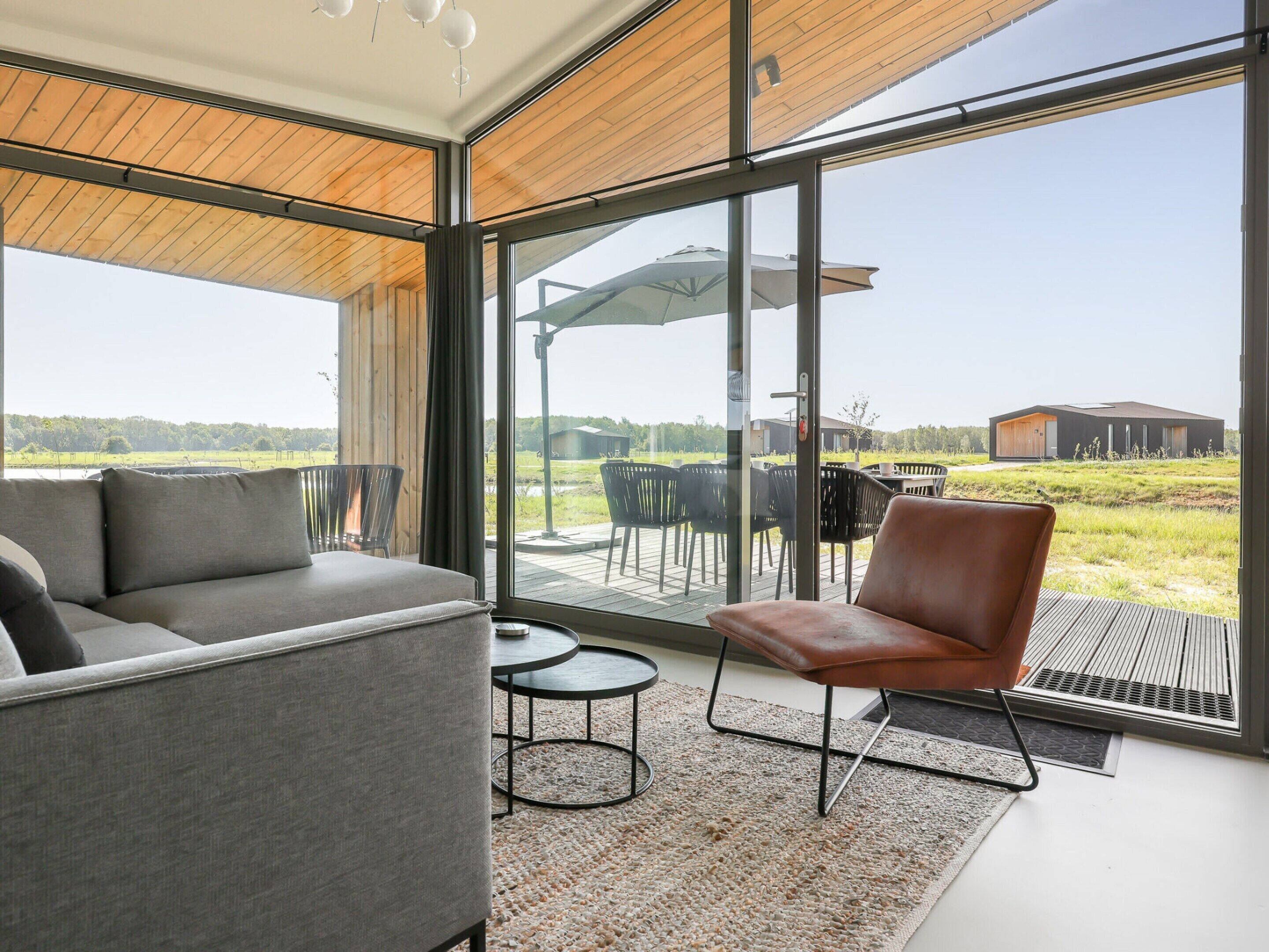 A modern interior with a sofa, a chair, and a small table.