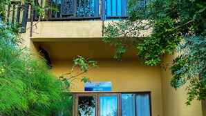 A stone staircase leading to a building with a 'Bali Suite' sign.