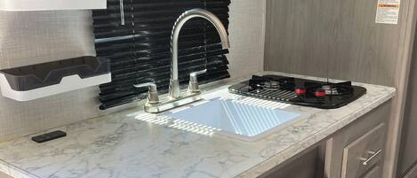 Fridge, microwave, stovetop, coffee/tea maker