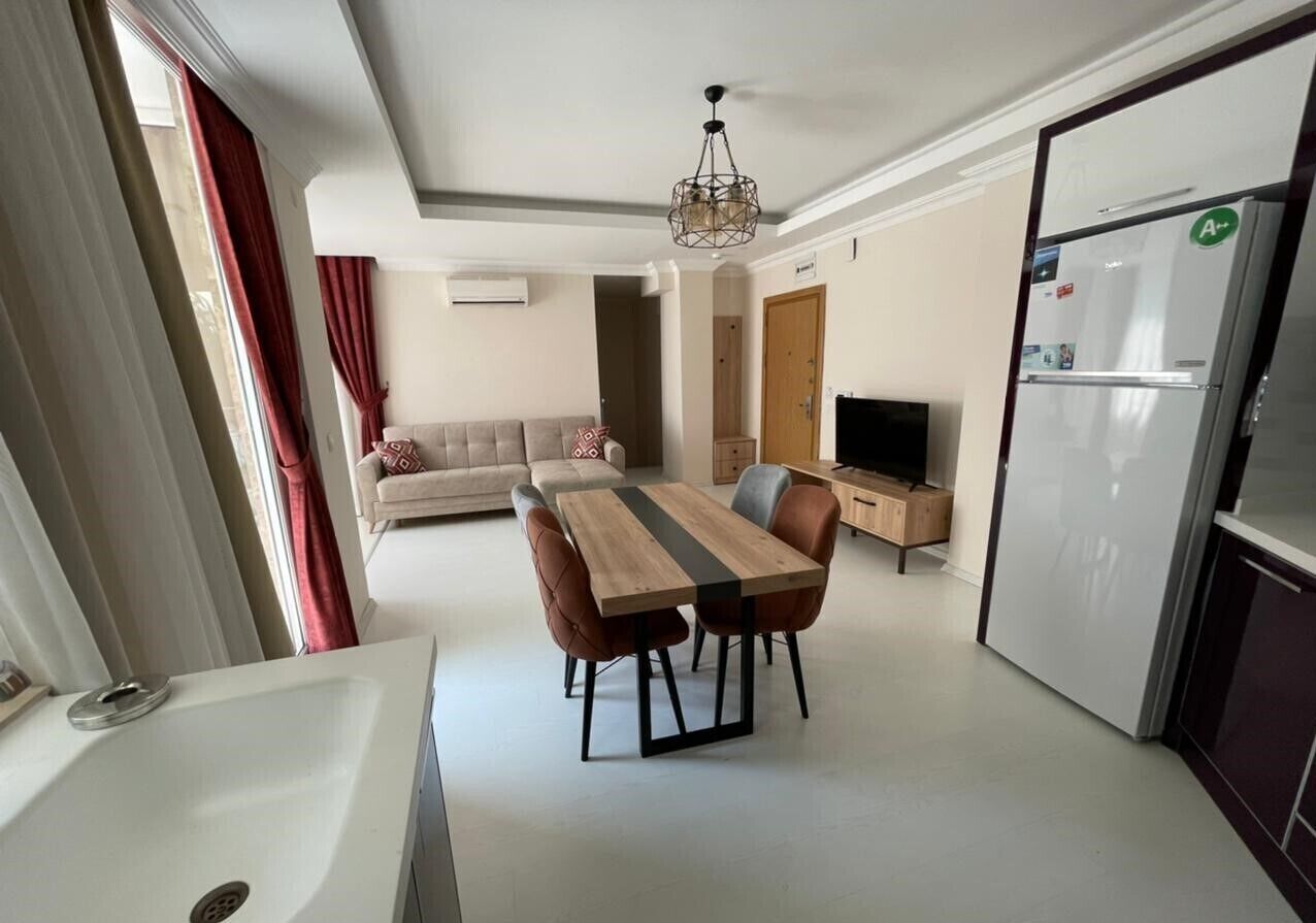 Basic Apartment, 1 Bedroom | Living area | 24-inch TV with satellite channels
