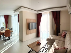 Family Apartment, 3 Bedrooms | Living area | 24-inch TV with satellite channels - Alfa Apart Hotel (Konyaalti)