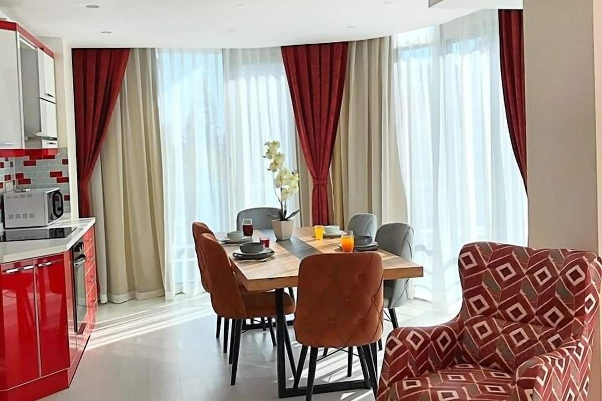 Family Apartment, 3 Bedrooms | Living area | 24-inch TV with satellite channels