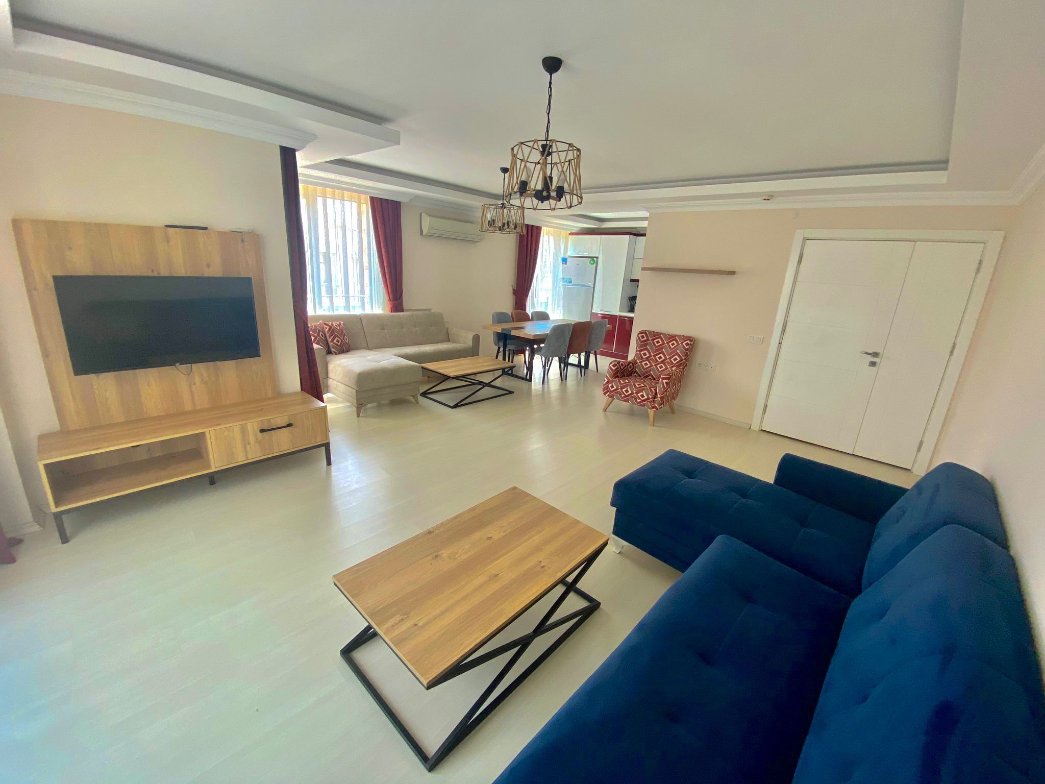 Deluxe Apartment | Living area | 24-inch TV with satellite channels