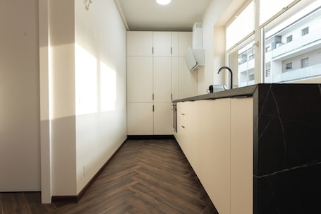 Deluxe Apartment, Balcony | Private kitchen. Nest Inn Charm Apartment