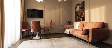 Appartement Deluxe, balcon | Aire de séjour | Téléviseur à écran plat