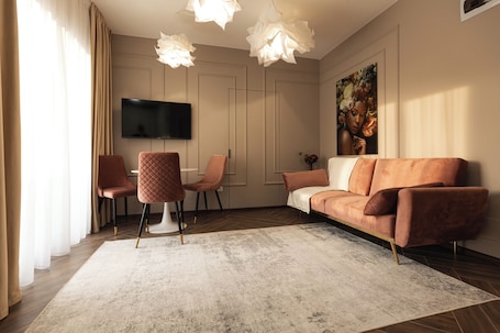 Deluxe Apartment, Balcony | Living area | Flat-screen TV. Nest Inn Charm Apartment