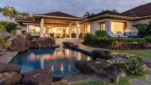 A house with a swimming pool, outdoor seating, and a covered patio area. - Waiulu Estate 152B – Ocean View & Fully Renovated | Onsite Staff & Daily Housekeeping (Kailua Kona)