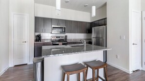 Fridge, dining tables - Landing | Modern 1BD, Gym, Pool (Pflugerville)