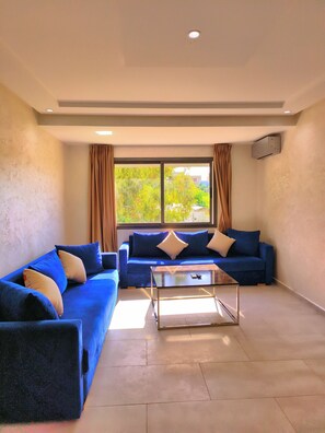 Apartment, 2 Bedrooms | Living area | 120-cm Smart TV with digital channels