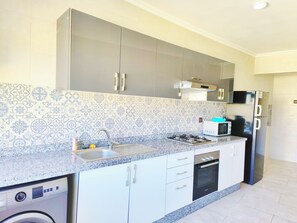Apartment, 1 Bedroom, Kitchen | Private kitchen | Full-size fridge, microwave, oven, stovetop