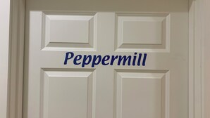 A white door with the name "Peppermill" in blue lettering. - Downtown Friday Harbor! Newly Built! PM (Friday Harbor)