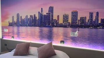 Deluxe Quadruple Room | In-room safe, individually decorated, desk, soundproofing