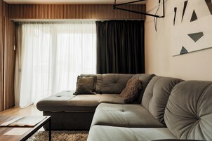 Business Apartment, Balcony, Garden View | Living area | Flat-screen TV