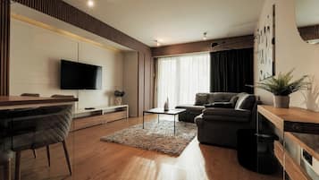 Business Apartment, Balcony, Garden View | Living area | Flat-screen TV