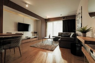Business Apartment, Balcony, Garden View | Living area | Flat-screen TV