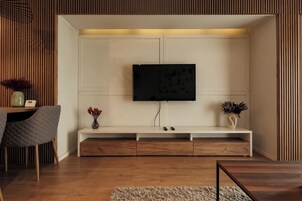 Business Apartment, Balcony, Garden View | Living area | Flat-screen TV