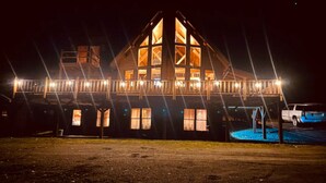 A large, multi-story building with a prominent central tower and multiple windows. - *Lake/Mtn View*Hot Tub*Firepace*Game Room* (Greenville)