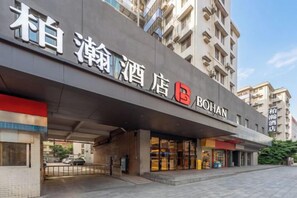 A hotel entrance with a modern facade, signage, and a visible entrance area. - Bohan Hotel (Guangzhou Financial City – Tangxia Metro Station Branch) (Guangzhou)