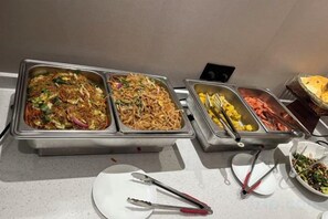 A buffet with multiple food stations including noodles, seafood, and salads. - Bohan Hotel (Guangzhou Financial City – Tangxia Metro Station Branch) (Guangzhou)