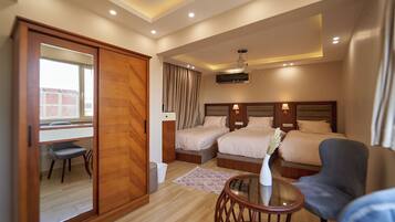 Comfort Triple Room, City View | Free minibar, in-room safe, individually decorated