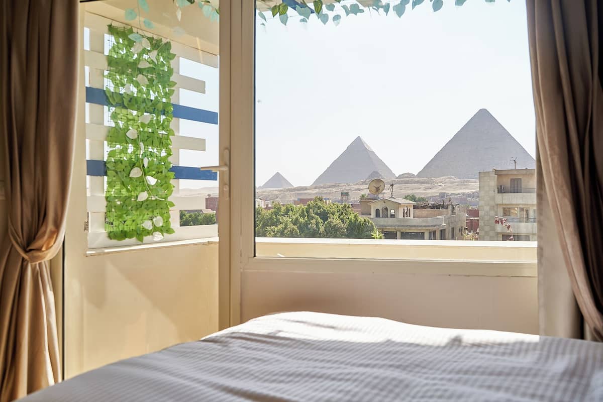 A hotel room with a view of the pyramids.