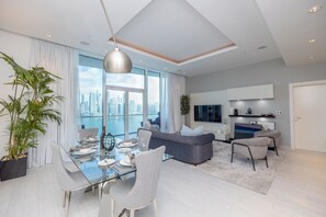 Deluxe Apartment, Balcony, Sea View | Living area | Flat-screen TV - WelHome - Oceanfront Elegance 1BR Apt With Palm Sea Views (Dubai)