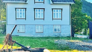 A large, two-story house with a steeply pitched roof and multiple windows. - 7 Person Holiday Home in Gurskoy (Heroy)
