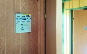 A wooden door with a control panel attached to it. - 7 Person Holiday Home in Karrebaeksminde (Karrebæksminde)