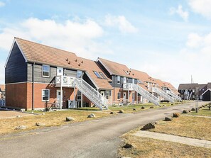 A row of modern apartment buildings with external staircases leading to the entrance. - 5 Person Holiday Park Home in Borre (Borre)