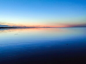 A calm body of water reflecting a sunset sky. - 8 Person Holiday Home in Hadsund (Hadsund)