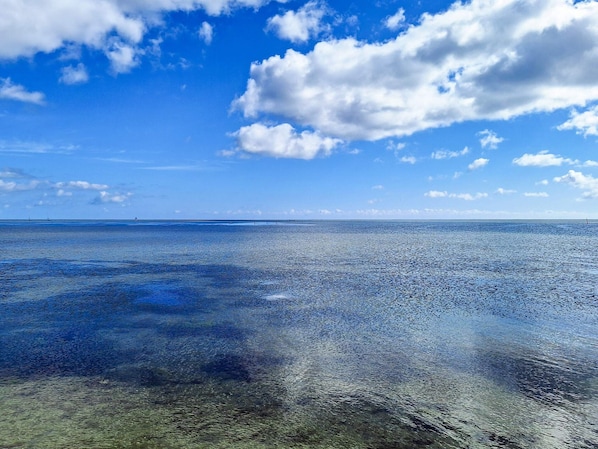 A clear view of a calm sea under a blue sky with scattered clouds. - 8 Person Holiday Home in Hadsund (Hadsund)