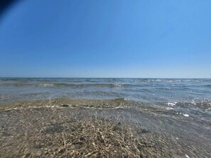 A beach with clear water and a clear sky. - 6 Person Holiday Home in Hadsund (Hadsund)