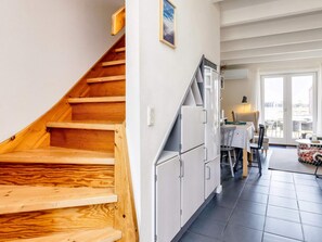 A staircase leading to a dining area with a view of the outdoors. - 6 Person Holiday Home in Hadsund (Hadsund)