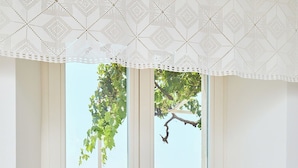 A room with a large window overlooking a pool and outdoor seating area. - Hedera Estate, Hedera A8 (Dubrovnik)