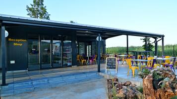 A reception shop with a covered outdoor seating area.