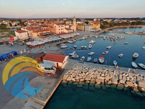 Stroll along the marina, surrounded by historic and modern architecture, and enjoy the bustling atmosphere of this charming coastal town.