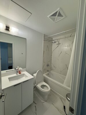 Hair dryer, towels, soap, toilet paper