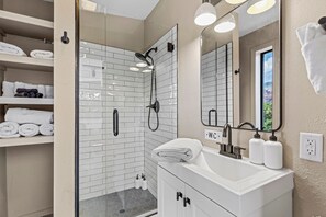 Shower, hair dryer, towels, soap