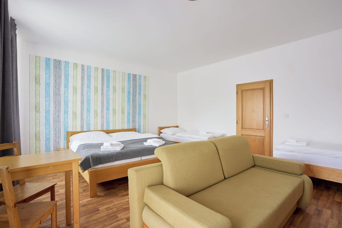 Deluxe Quadruple Room, Balcony | 1 bedroom, desk, laptop workspace, free WiFi