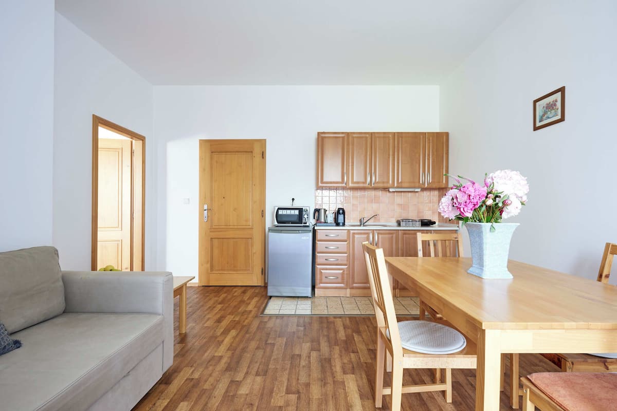 Deluxe Suite, Balcony | 1 bedroom, desk, laptop workspace, free WiFi