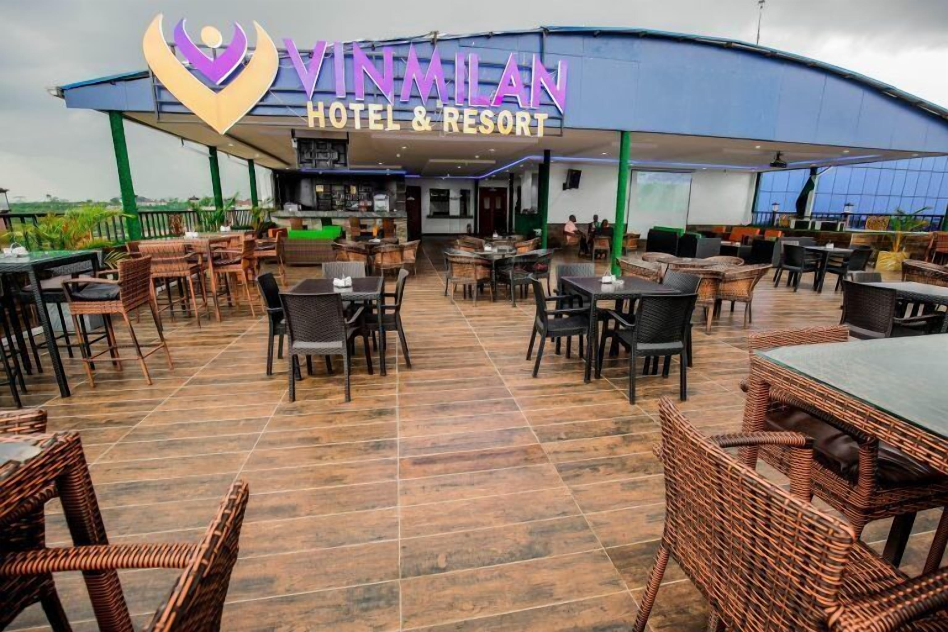 Vinmilan Hotel & Resort with outdoor seating and a covered patio area.