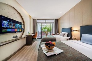A hotel room with a flat-screen TV, a bed with a headboard, a desk with a chair, and a balcony with a view. - Yueting Hotel Selected (Nantong Gongnong North Road) (Nantong)