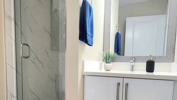 Shower, hair dryer, towels, soap
