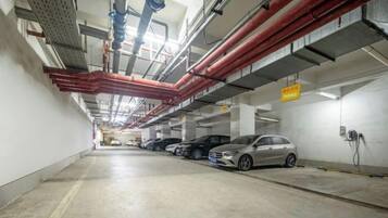 A multi-level parking garage with cars parked on several levels.