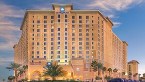 A large, multi-story hotel with a prominent 'WYNDHAM' sign at the top.