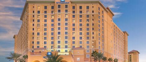 A large, multi-story hotel with a prominent 'WYNDHAM' sign at the top.