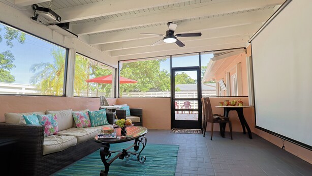 A spacious room with a sofa, a coffee table, and a ceiling fan. - Casa Bay-Spacious Family Friendly 4 Bedroom Home with Ultimate Backyard Fun! (Cutler Bay)